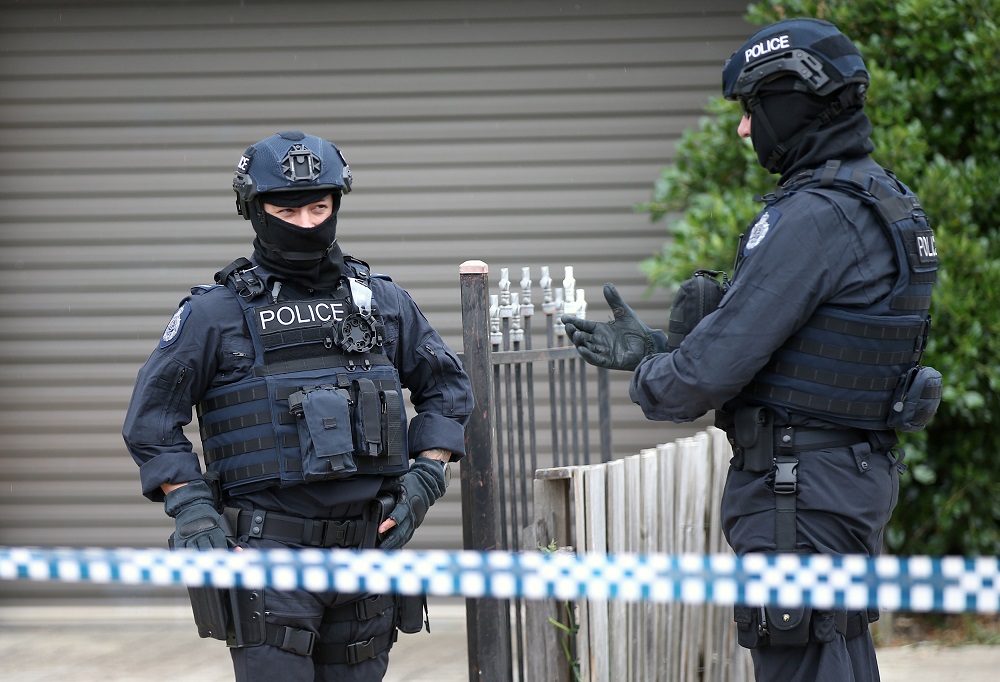 Police officers that form part of the Australian Joint Counter Terrorism Team outside a home they raided as part of an operation to arrest three men who were allegedly preparing to attack the public in Melbourne, November 20, 2018. u00e2u20acu201d Reuters pic 