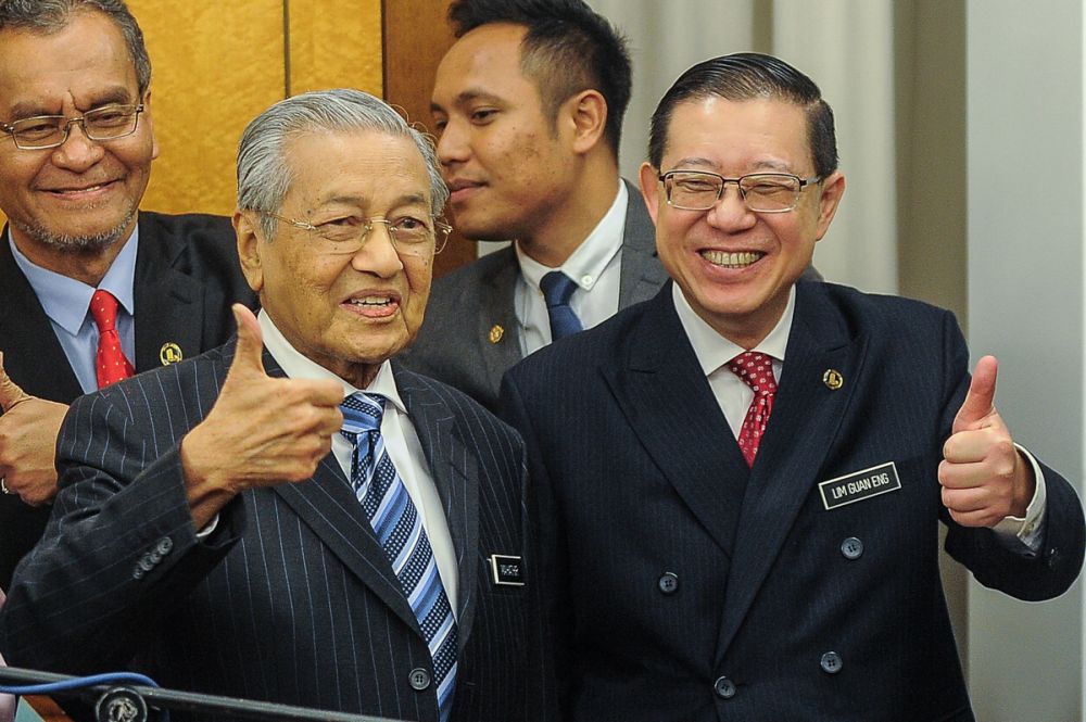 Finance Minister Lim Guan Eng and Prime Minister Tun Dr Mahathir Mohamad pose for the cameras in Parliament November 2, 2018. u00e2u20acu201d Picture by Shafwan Zaidon