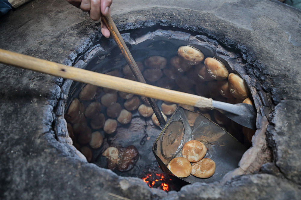 The 'heong peah' are baked to golden brown inside the kiln.