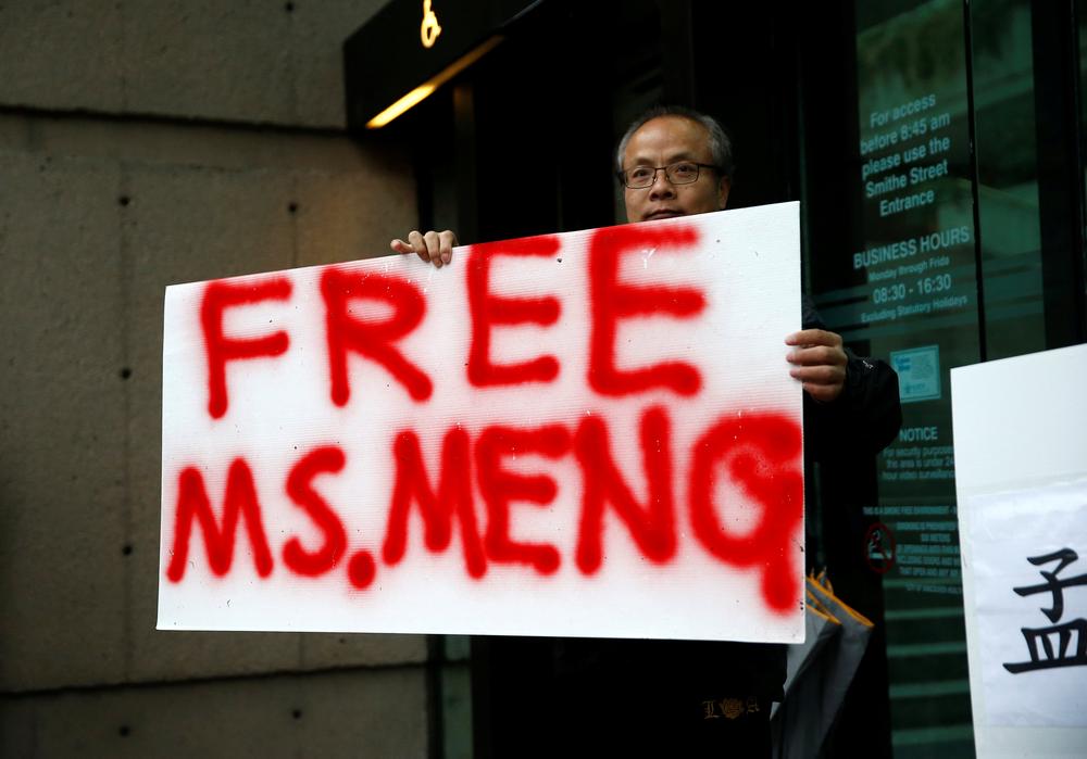 Robert Long holds a sign outside the BC Supreme Court bail hearing of Huawei CFO Meng Wanzhou, who was held on an extradition warrant in Vancouver, Canada December 11, 2018. u00e2u20acu201d Reuters pic