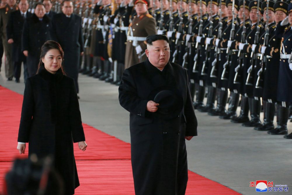 North Korean leader Kim Jong-un and wife Ri Sol-ju inspect an honour guard before leaving Pyongyang for a visit to China, in this January 7, 2019 photo released January 8, 2019. u00e2u20acu201d KCNA pic via Reuters