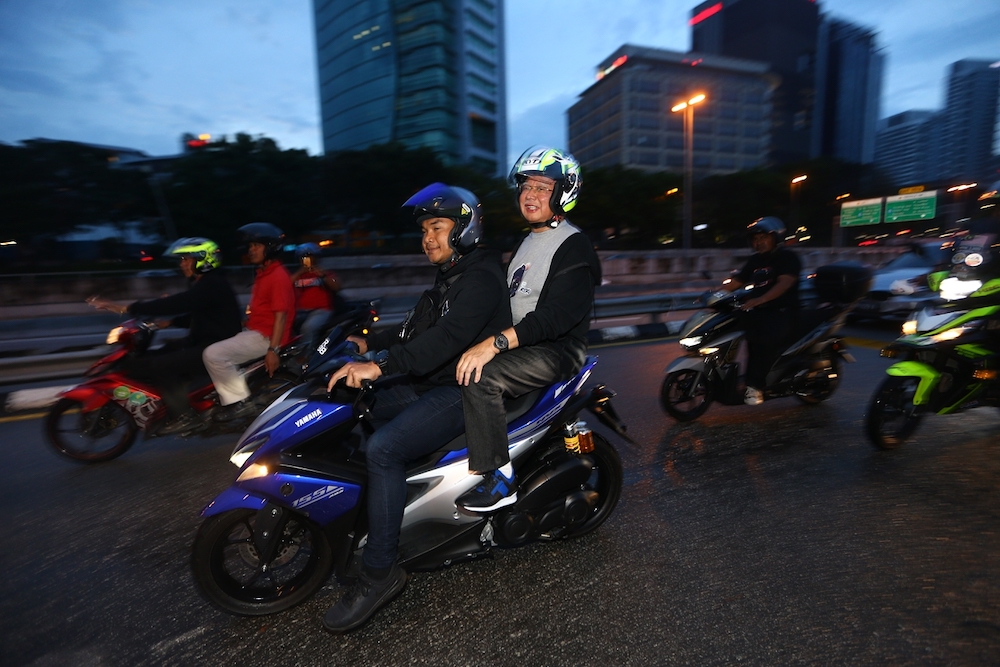 Datuk Seri Najib Razak goes for a ride with a motorcycle enthusiast at the Podium in Kuala Lumpur January 20, 2019. u00e2u20acu201d Picture by Ahmad Zamzahuri