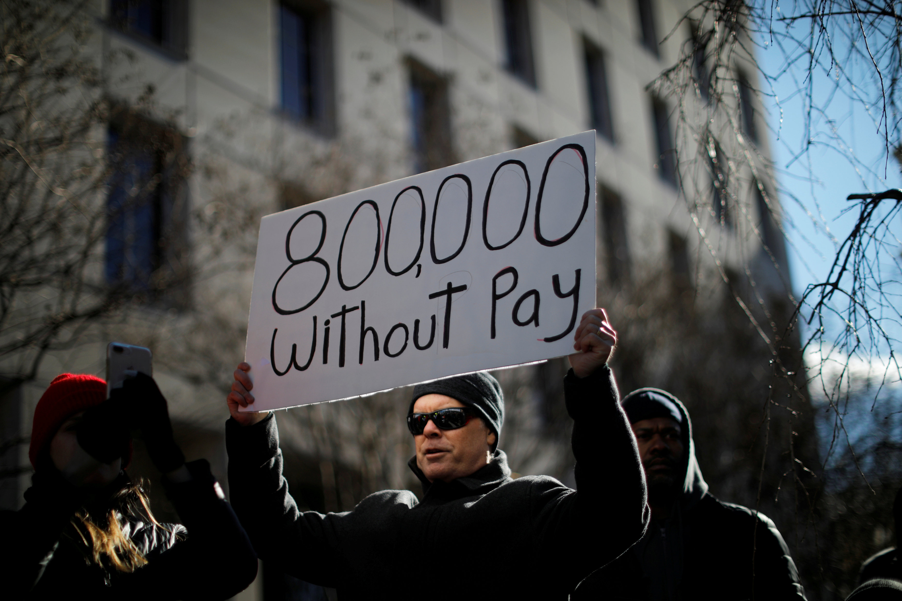 A demonstrator holds a sign, signifying hundreds of thousands of federal employees who wonu00e2u20acu2122t be receiving their paychecks as a result of the partial government shutdown, during a rally in Washington January 10, 2019. u00e2u20acu201d Reuters pic