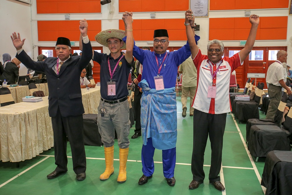Candidates for the Cameron Highlands by-election (from left) Sallehudin Ab Talib, Wong Seng Yee,  Ramli Mohd Noor and M. Manogaran pose for a group picture at the nomination center at SMK Sultan Ahmad Shah January 12, 2019. u00e2u20acu201d Picture by Farhan Najib
