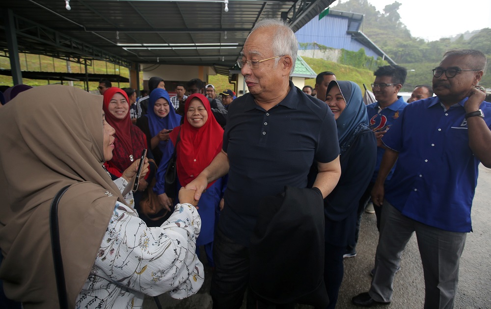 Datuk Seri Najib Razak is greeted by members of the public upon his arrival at the Masjid Kampung Raja in Cameron Highlands January 17, 2019. u00e2u20acu201d Picture by Farhan Najib