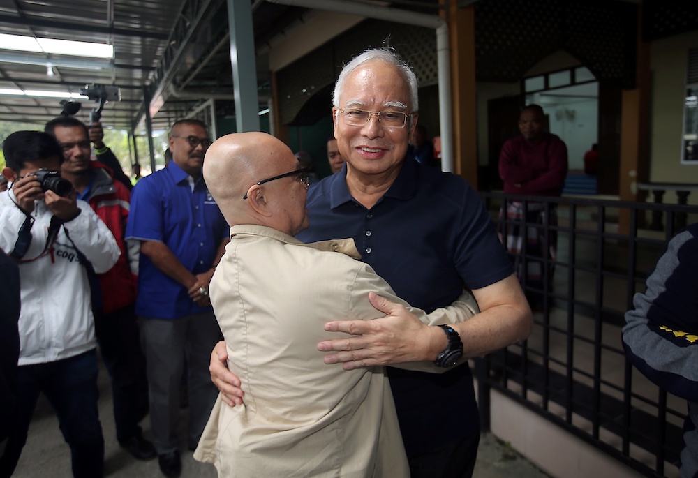 A man hugs Datuk Seri Najib Razak upon his arrival at the Masjid Kampung Raja in Cameron Highlands January 17, 2019. u00e2u20acu201d Picture by Farhan Najib