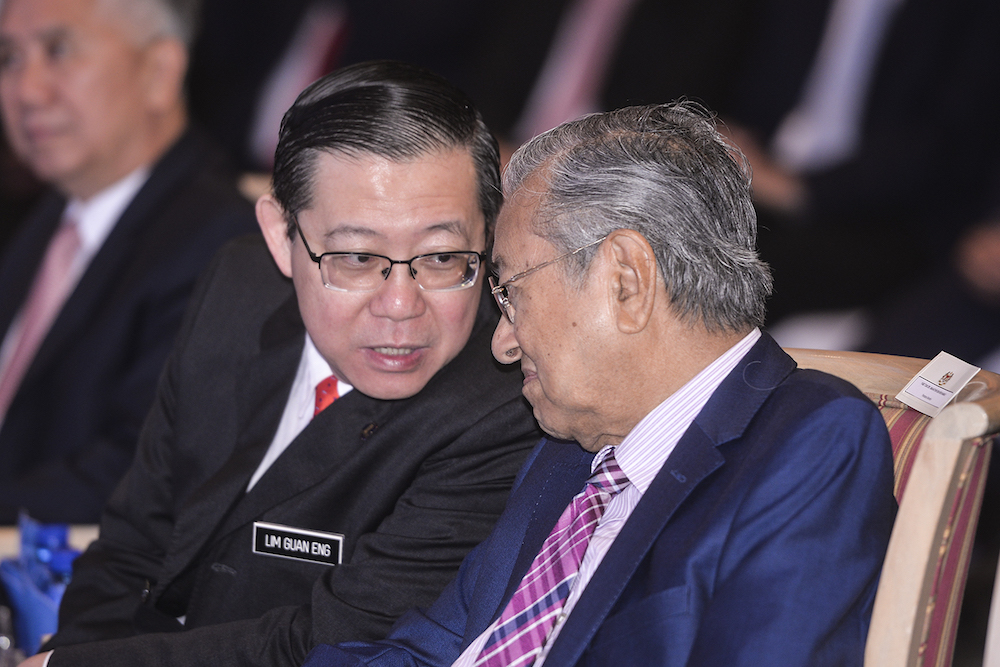 Tun Dr Mahathir Mohamad and Lim Guan Eng attend the launch of mySalam in Putrajaya January 24, 2019. u00e2u20acu201d Picture by Shafwan Zaidon