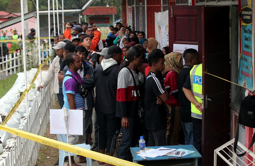 People wait in line to cast their votes at SK Menson in Cameron Highlands January 26, 2019. u00e2u20acu201d Picture by Farhan Najib