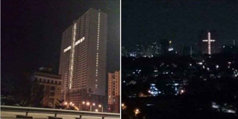 An image of a cross formed by lights in a building in Jelutong have caused consternation among some residents in the surrounding area. u00e2u20acu201d Composite via Facebook