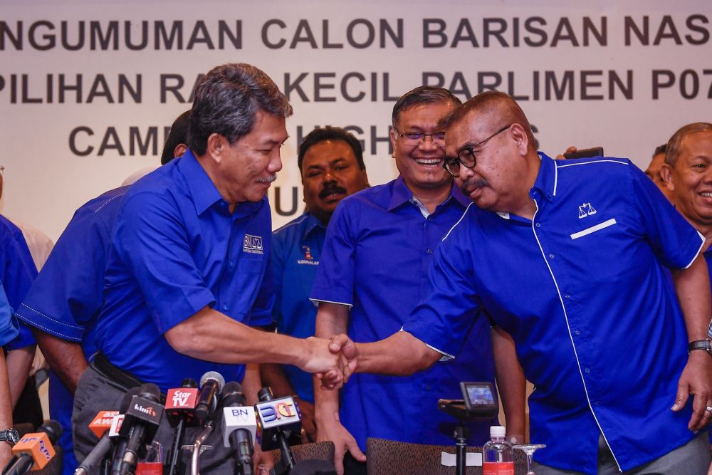 BN deputy chairman Datuk Seri Mohamad Hasan shakes hands with Cameron Highlands candidate Ramli Mohd Noor during a press conference at the Seri Pacific Hotel Kuala Lumpur January 10, 2019. u00e2u20acu201d Picture by Hari Anggarann