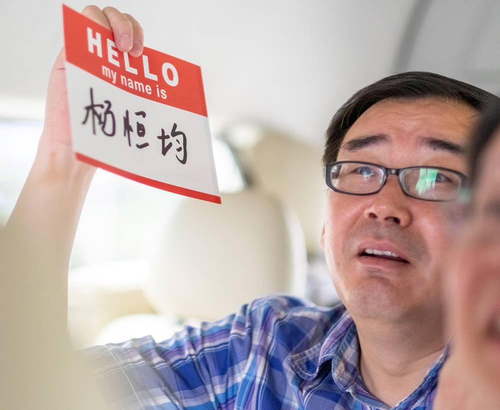 Yang Hengjun, author and former Chinese diplomat, who is now an Australian citizen, display a name tag in an unspecified location in Tibet, China mid-July, 2014 in this social media image. u00e2u20acu201d Reuters pic