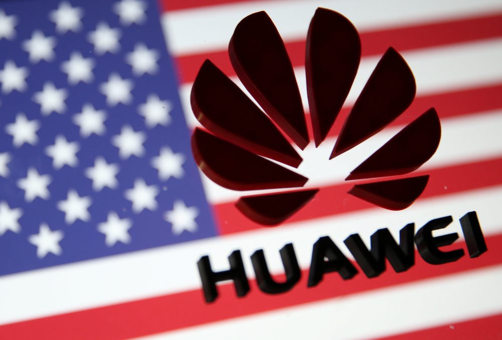 A 3D printed Huawei logo is placed on glass above displayed US flag in this illustration taken January 29, 2019. u00e2u20acu201d Reuters pic