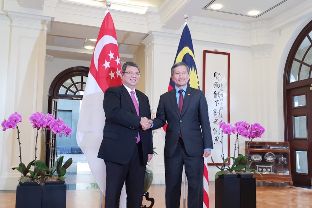 Foreign Minister Datuk Saifuddin Abdullah (left) shakes hands with his Singaporean counterpart Dr Vivian Balakrishnan before a bilateral meeting in Singapore January 8, 2019. u00e2u20acu201d Picture courtesy of Ministry of Foreign Affairs