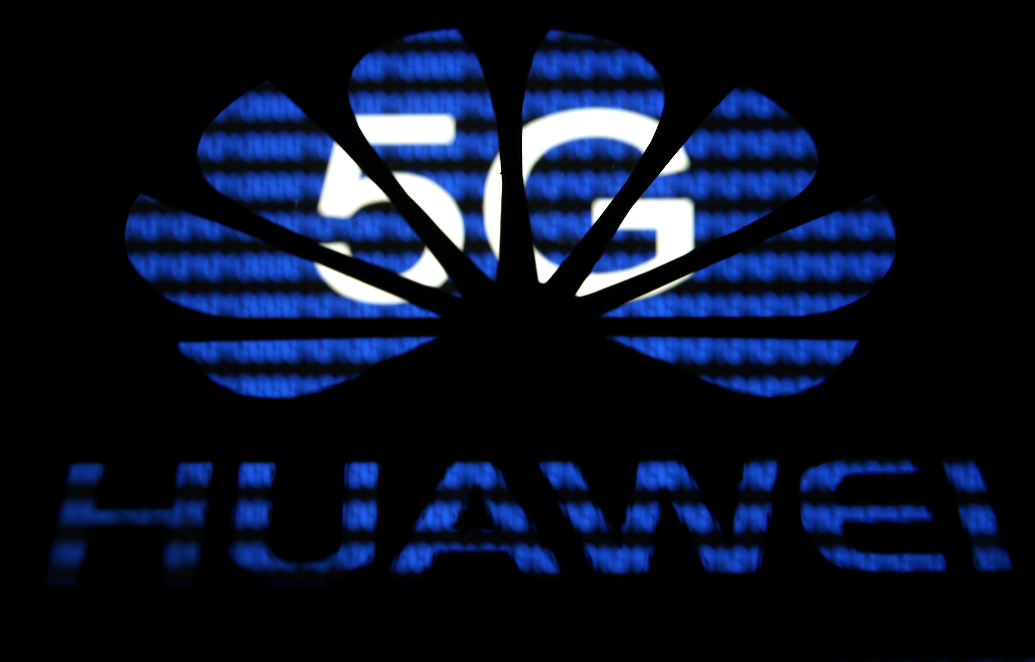 A 3-D printed Huawei logo is seen in front of displayed 5G words in this illustration taken February 12, 2019. u00e2u20acu201d Reuters pic