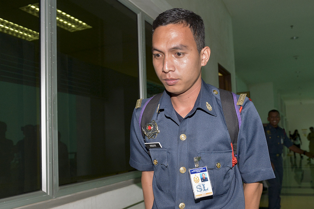 Witness Mohd Sharol Anuar Kamarudin leaves after attending the inquest into the death of firefighter Muhammad Adib Mohd Kassim at the Shah Alam Court Complex February 14, 2019. u00e2u20acu201d Picture by Mukhriz Hazim