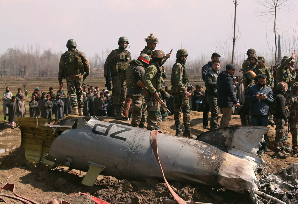 Indian soldiers stand next to the wreckage of an Indian Air Force helicopter after it crashed in Budgam district in Kashmir February 27, 2019. u00e2u20acu201d Reuters pic