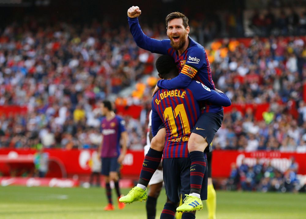 Barcelona's Lionel Messi celebrates scoring their second goal with Ousmane Dembele. u00e2u20acu201d Reuters pic