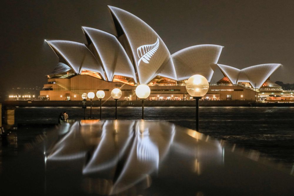 The sails of the Sydney Opera House are seen lit March 17, 2019 with the design of New Zealandu00e2u20acu2122s silver fern in a show of solidarity with victims of the Christchurch mosque attacks, in Sydney. u00e2u20acu201d Salty Dingo/State of New South Wales pic via AFP