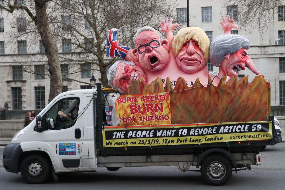 An anti-Brexit message on the back of a van is seen driving through Central London by the government buildings on Whitehall March 19, 2019. u00e2u20acu201d Daniel Leal-Olivas pic via AFP