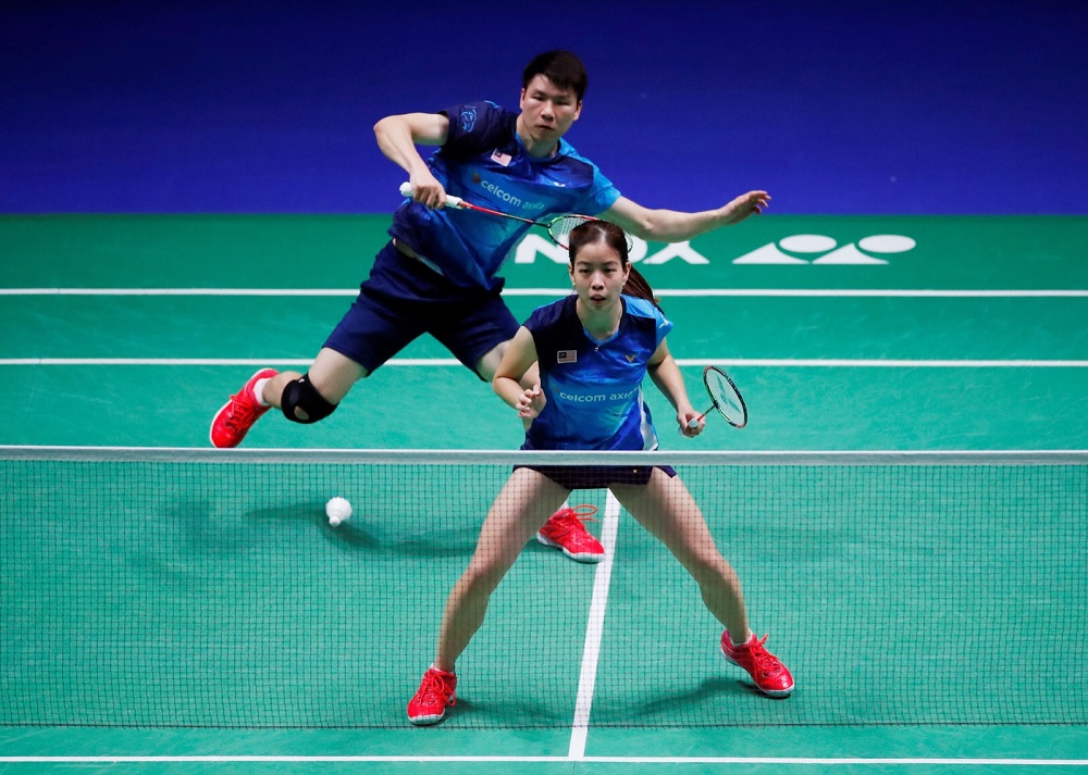 Shevon Jemie Lai and Soon Huat Goh in action during their second round match against England's Marcus Ellis and Lauren Smith   at Arena Birmingham March 7, 2019. u00e2u20acu201d Action Images via Reuters/Andrew Boyers