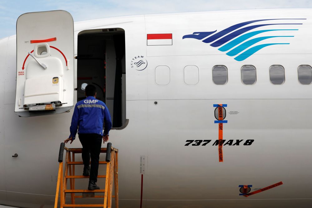 A technician prepares to check Garuda Indonesiau00e2u20acu2122s Boeing 737 Max 8 airplane parked at the Garuda Maintenance Facility AeroAsia, at Soekarno-Hatta International airport near Jakarta, Indonesia, March 13, 2019. u00e2u20acu201d Reuters pic