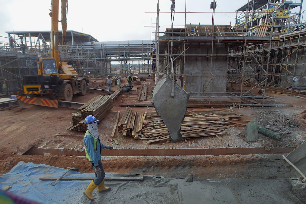 A worker walks inside the Lynas factory compound in Gebeng, April 19, 2012. u00e2u20acu201d Reuters pic