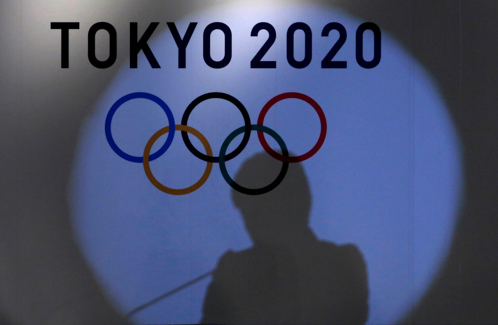 A shadow of of Tokyo governor Yuriko Koike is seen on the logo of Tokyo 2020 Olympic games during the Olympic and Paralympic flag-raising ceremony at Tokyo Metropolitan Government Building in Tokyo, Japan, September 21, 2016. u00e2u20acu201d Reuters pic