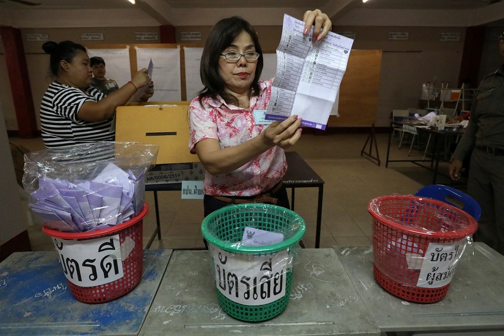 An electoral staff member shows a ballot during vote counting at the general election in Mae Hong Son, Thailand March 24, 2019. u00e2u20acu201d Reuters pic       
