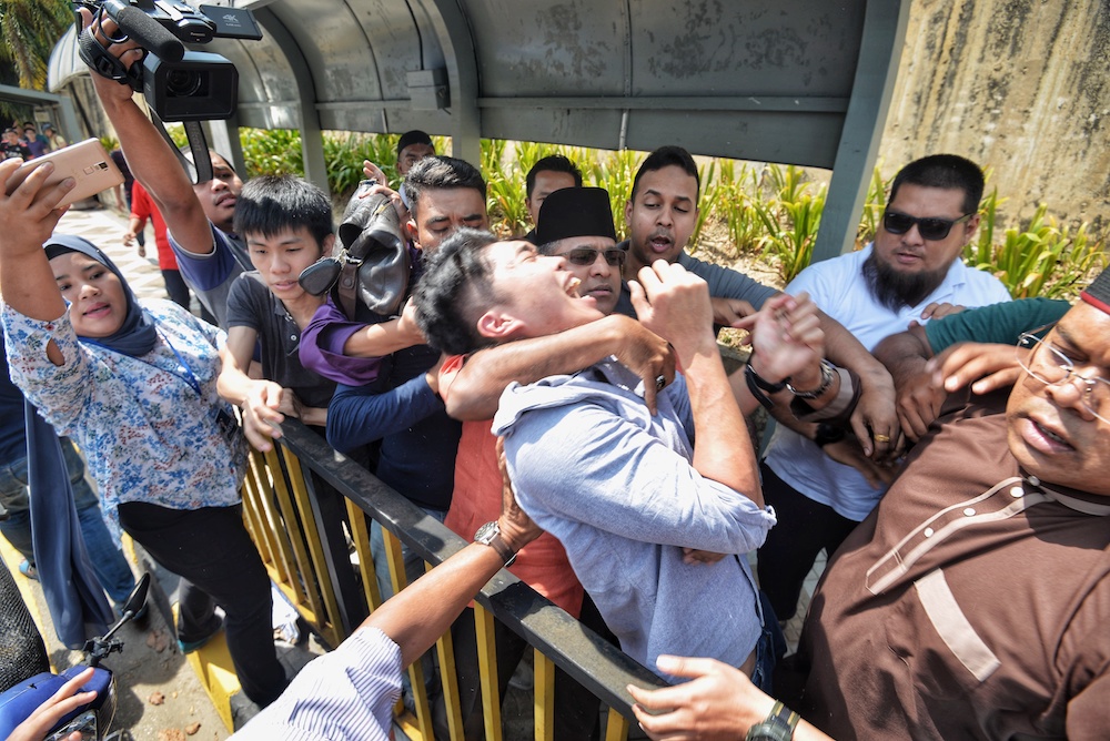 Students protest Datuk Seri Najib Razaku00e2u20acu2122s meet-and-greet session in front of Restoran Amjal near Universiti Malaya in Kuala Lumpur March 22, 2019. u00e2u20acu201d Picture by Shafwan Zaidon