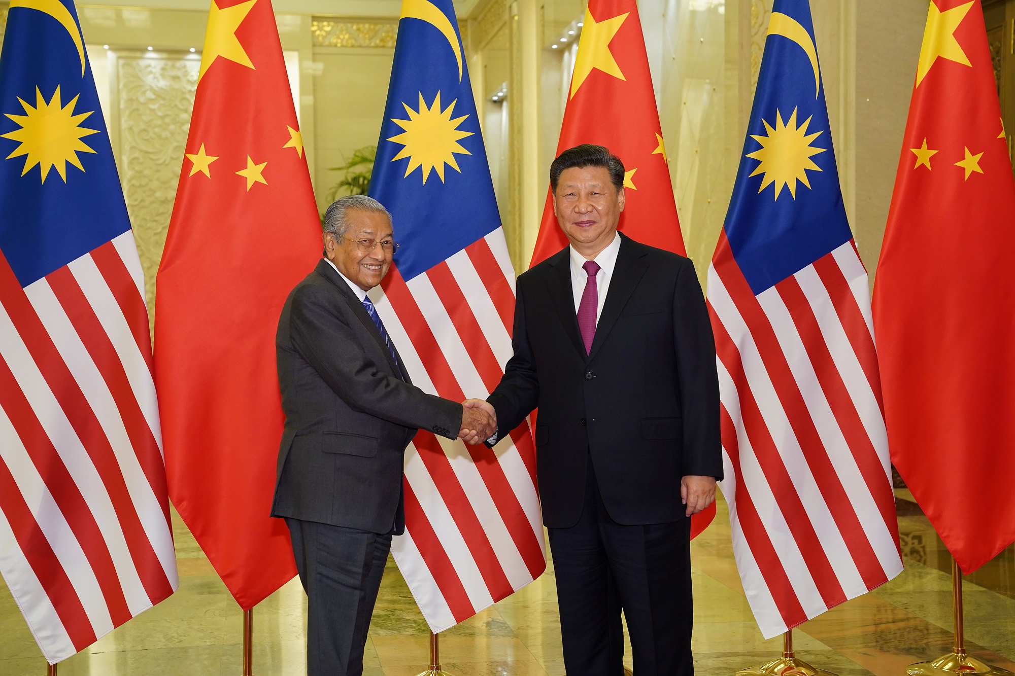 Chinese President Xi Jinping shakes hands with Prime Minister Tun Dr Mahathir Mohamad before the bilateral meeting of the Second Belt and Road Forum at the Great Hall of the People in Beijing April 25, 2019. u00e2u20acu201d Reuters pic