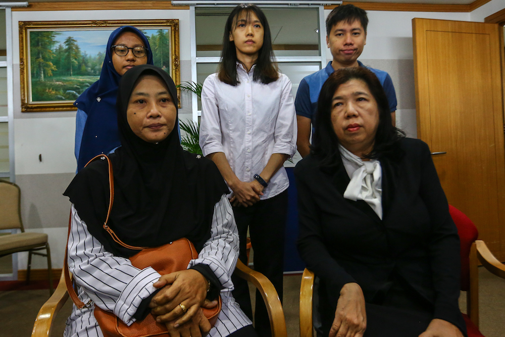 The families of pastor Raymond Koh and Amri Che Mat attend the announcement of Suhakamu00e2u20acu2122s public inquiry findings into their disappearances in Kuala Lumpur April 3, 2019. u00e2u20acu201d Picture by Hari Anggara