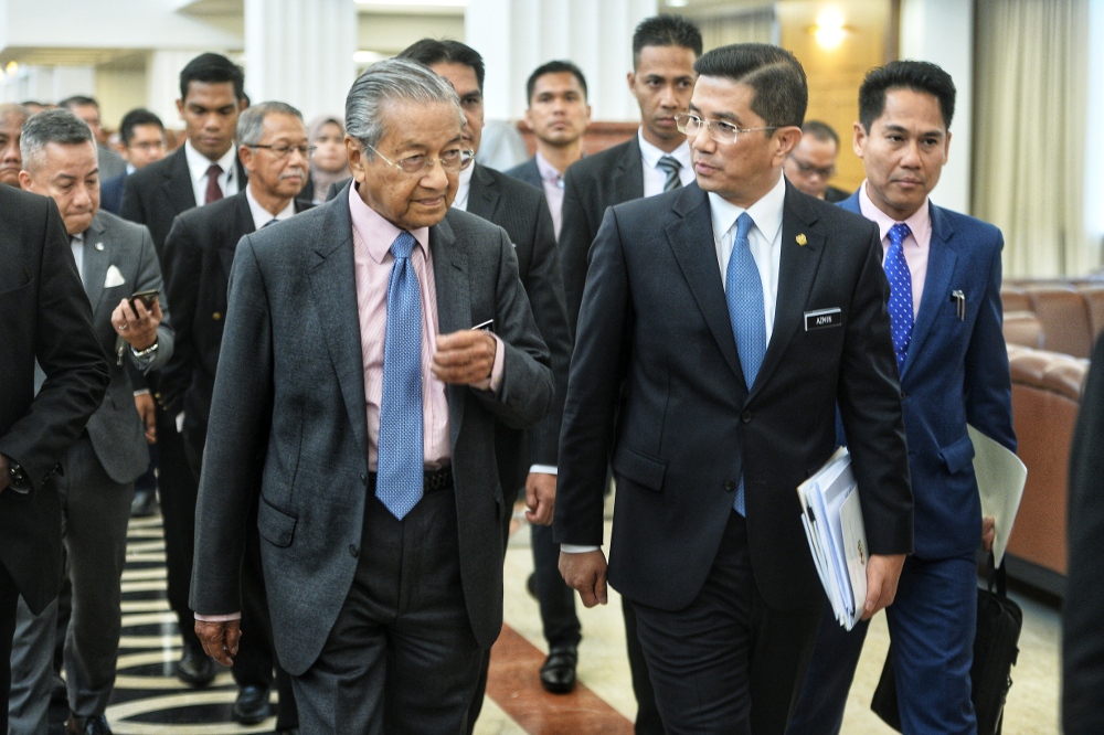 Prime Minister Tun Dr Mahathir Mohamad and Minister of Economic Affairs Datuk Seri Mohamed Azmin Ali are seen in Parliament April 10, 2019. u00e2u20acu201d Picture by Shafwan Zaidon 