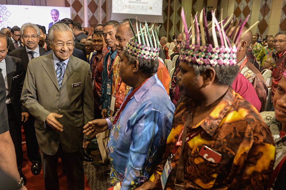 Tun Dr Mahathir Mohamad greets attendees of the Orang Asli National Convention 2019 in Putrajaya April 22, 2019. u00e2u20acu201d Picture by Miera Zulyana