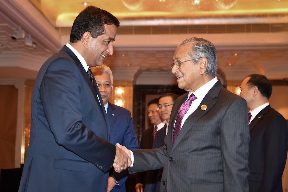 Prime Minister Tun Dr Mahathir Mohamad shakes hands with Adviser to Prime Minister of Pakistan, Malik Amin Aslam in Beijing April 26, 2019. u00e2u20acu201d Bernama pic