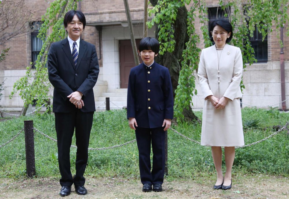 In this file photo taken April 8, 2019 Japanu00e2u20acu2122s Prince Hisahito (centre) and his parents Prince Akishino (left) and Princess Kiko pose for photos at Ochanomizu University junior high school in Tokyo. u00e2u20acu201d Koji Sasahara/Pool pic via AFP