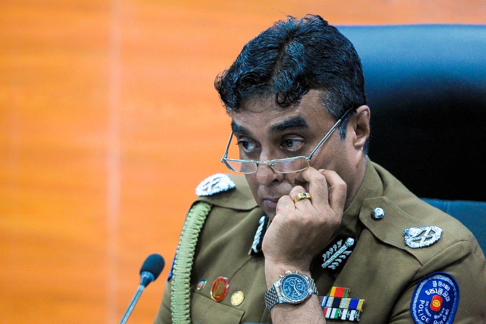 In this file photo taken March 7, 2017 Sri Lanka police chief Pujith Jayasundara looks on after launching the first on-line service delivery of the Sri Lankan police at the headquarters in Colombo on March 7, 2017. u00e2u20acu201d AFP pic