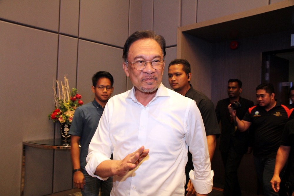 First Picture: PKR president Datuk Seri Anwar Ibrahim gestures to his party members during a townhall session entitled u00e2u20acu02dcMillennials Challenge Towards New Malaysiau00e2u20acu2122 in the Grand Paragon Hotel in Johor Baru today. u00e2u20acu201d Picture by Ben Tannn