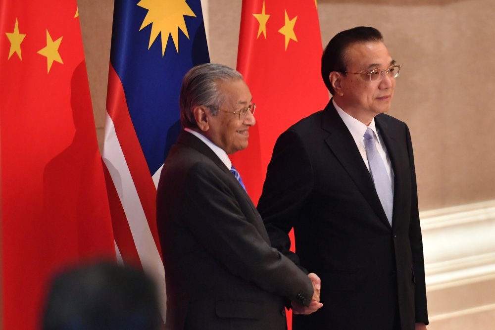 Prime Minister Tun Dr Mahathir Mohamad shakes hands with Chinese Premier Li Keqiang before their meeting at the Diaoyutai State Guesthouse in Beijing April 25, 2019. u00e2u20acu2022 Reuters pic