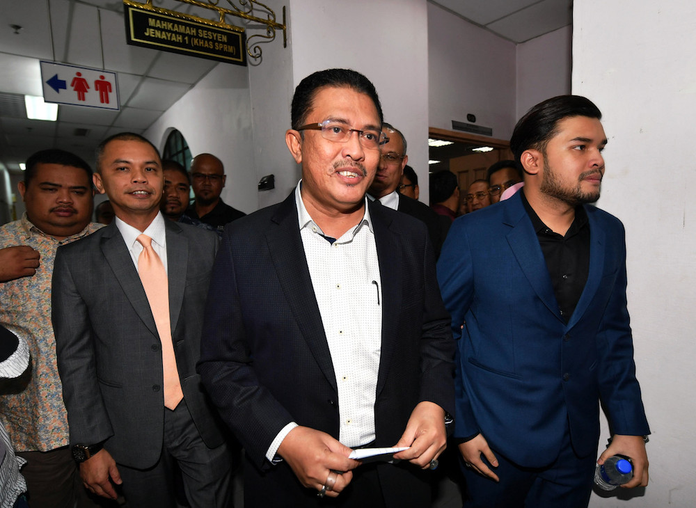 (From left) Amir Sharifuddin Abd Raub, Datuk Abdul Latif Bandi and Ahmad Fauzan Hatim Abd Latif leave the Sessions Court in Johor Baru April 21, 2019. u00e2u20acu201d Bernama pic