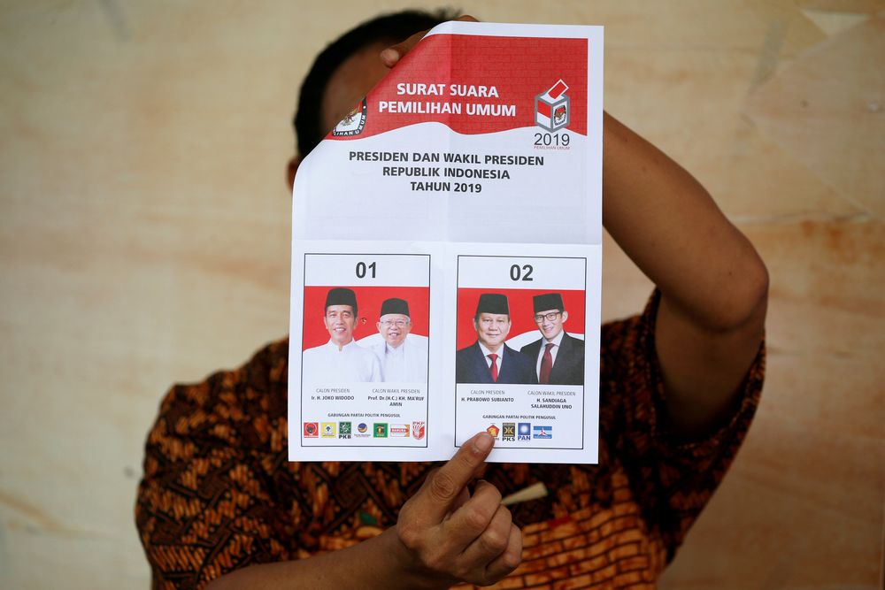 A person holds up a voting ballot during the counting of the Indonesian elections results in Jakarta, Indonesia April 17, 2019. u00e2u20acu201d Reuters pic