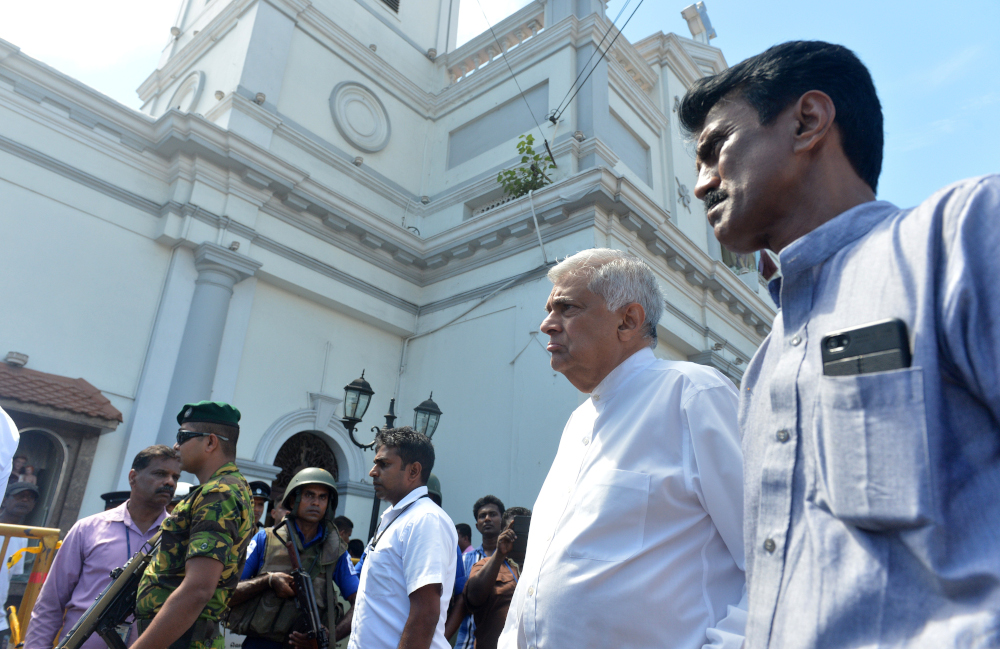 Sri Lankan Prime Minister Ranil Wickremasinghe (second from right) arrives to visit the site of a bomb attack at St Anthonyu00e2u20acu2122s Shrine in Kochchikade in Colombo April 21, 2019. u00e2u20acu201d AFP pic