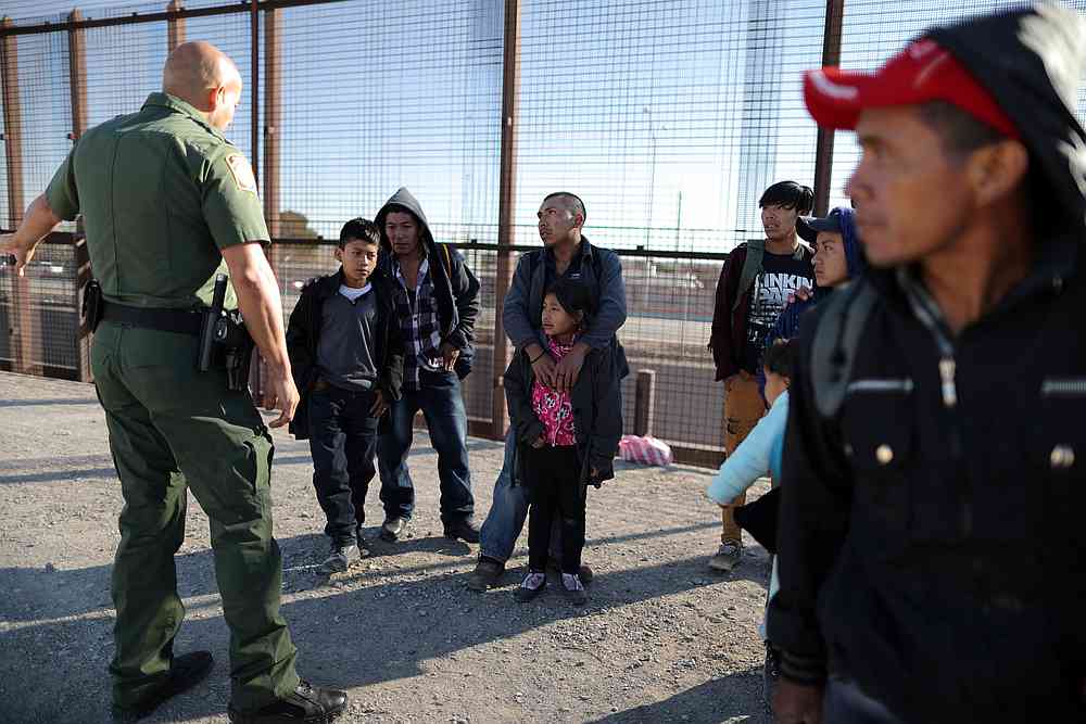 A group of Central American migrants is questioned about their children's health after surrendering to US Border Patrol Agents south of the US-Mexico border fence in El Paso, Texas March 6, 2019. u00e2u20acu201d Reuters pic