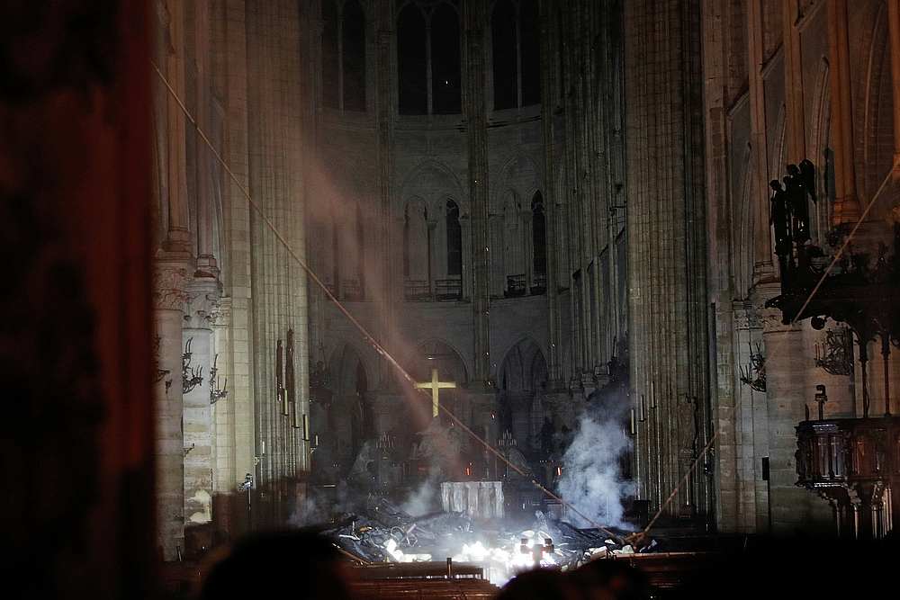 Smoke rises around the altar in front of the cross inside the Notre Dame Cathedral as a fire continues to burn in Paris April 16, 2019. u00e2u20acu201d Reuters pic