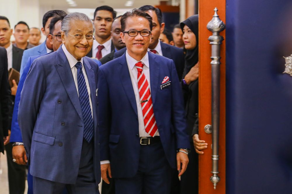 Prime Minister Tun Dr Mahathir Mohamad is pictured with Minister in the Prime Minister's Department Datuk Liew Vui Keong in Parliament April 9, 2019. u00e2u20acu201d Picture by Hari Anggara