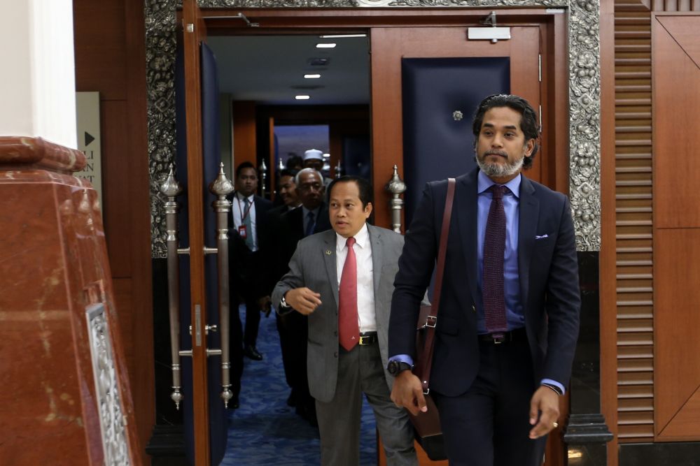 Opposition lawmakers are pictured walking out of Parliament chambers April 2, 2019. u00e2u20acu201d Picture by Ahmad Zamzahuri