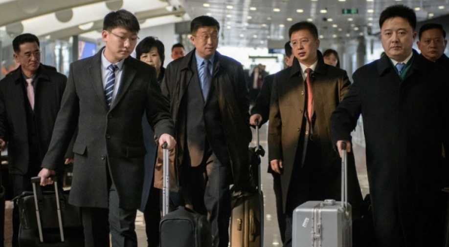 This file photo taken on February 19, 2019 shows a man believed to be North Korean negotiator Kim Hyok Chol (centre left-blue tie) after arriving on an Air Koryo flight from Pyongyang, at Beijing international airport. u00e2u20acu201d AFP pic