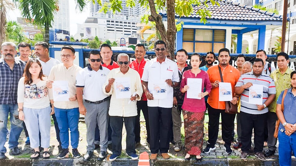 Seri Delima Assemblymen Syerleena Rashid (3rd right) and Jelutong MP RSN Rayer pose for pictures after lodging a police report at the Northeast District Police Station in George Town May 22, 2019. u00e2u20acu201d Picture by Sayuti Zainudin