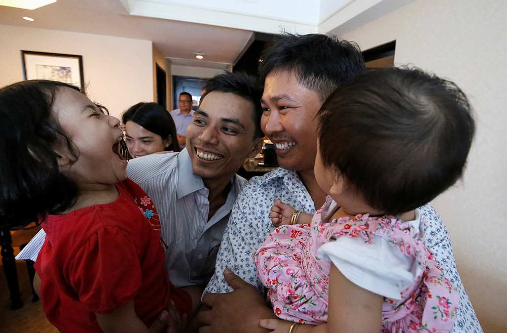 Reuters reporters Wa Lone (right) and Kyaw Soe Oo celebrate with their children after being freed from prison, after receiving a presidential pardon in Yangon, Myanmar, May 7, 2019.  u00e2u20acu201d Reuters pic