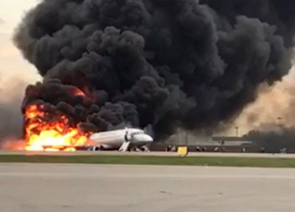 A passenger plane is seen on fire after an emergency landing at the Sheremetyevo Airport outside Moscow May 5, 2019. u00e2u20acu201d Investigative Committee of Russia handout via Reuters