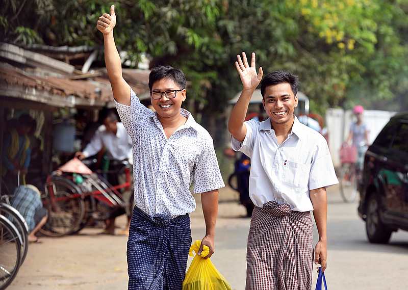 Reuters reporters Wa Lone (left) and Kyaw Soe Oo gesture as they walk free outside Insein prison after receiving a presidential pardon in Yangon, Myanmar May 7, 2019. u00e2u20acu201d Reuters pic